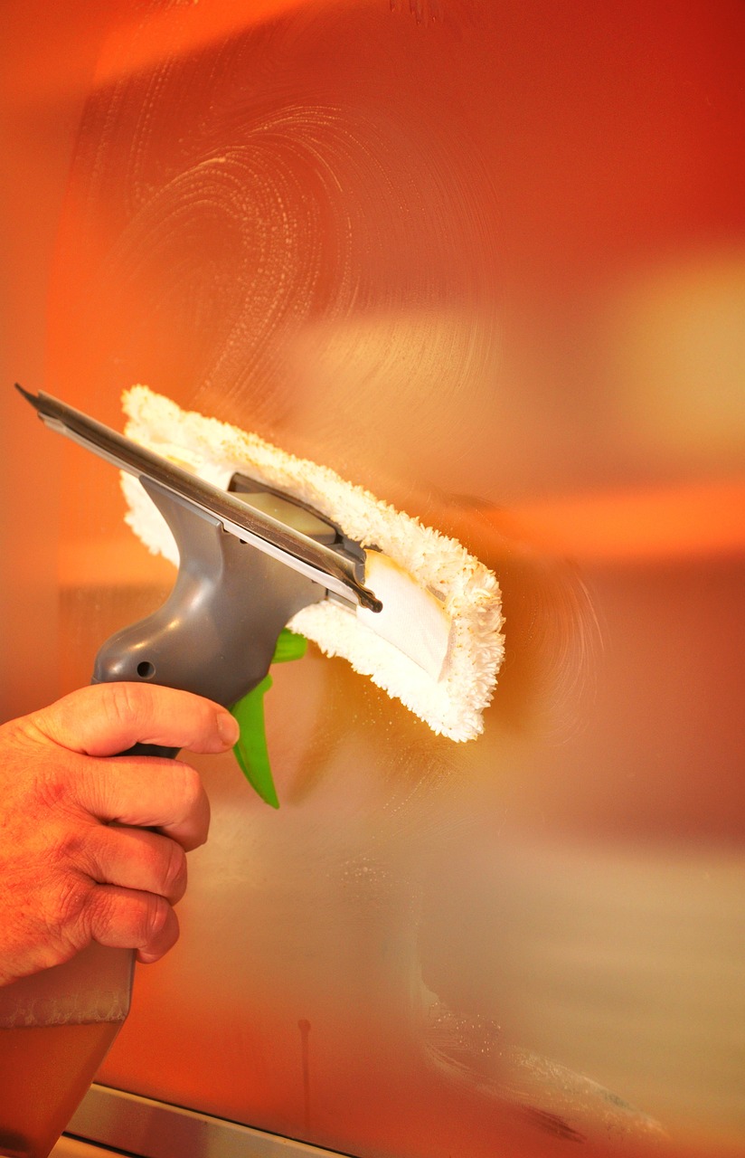 Cleaning a shop window.