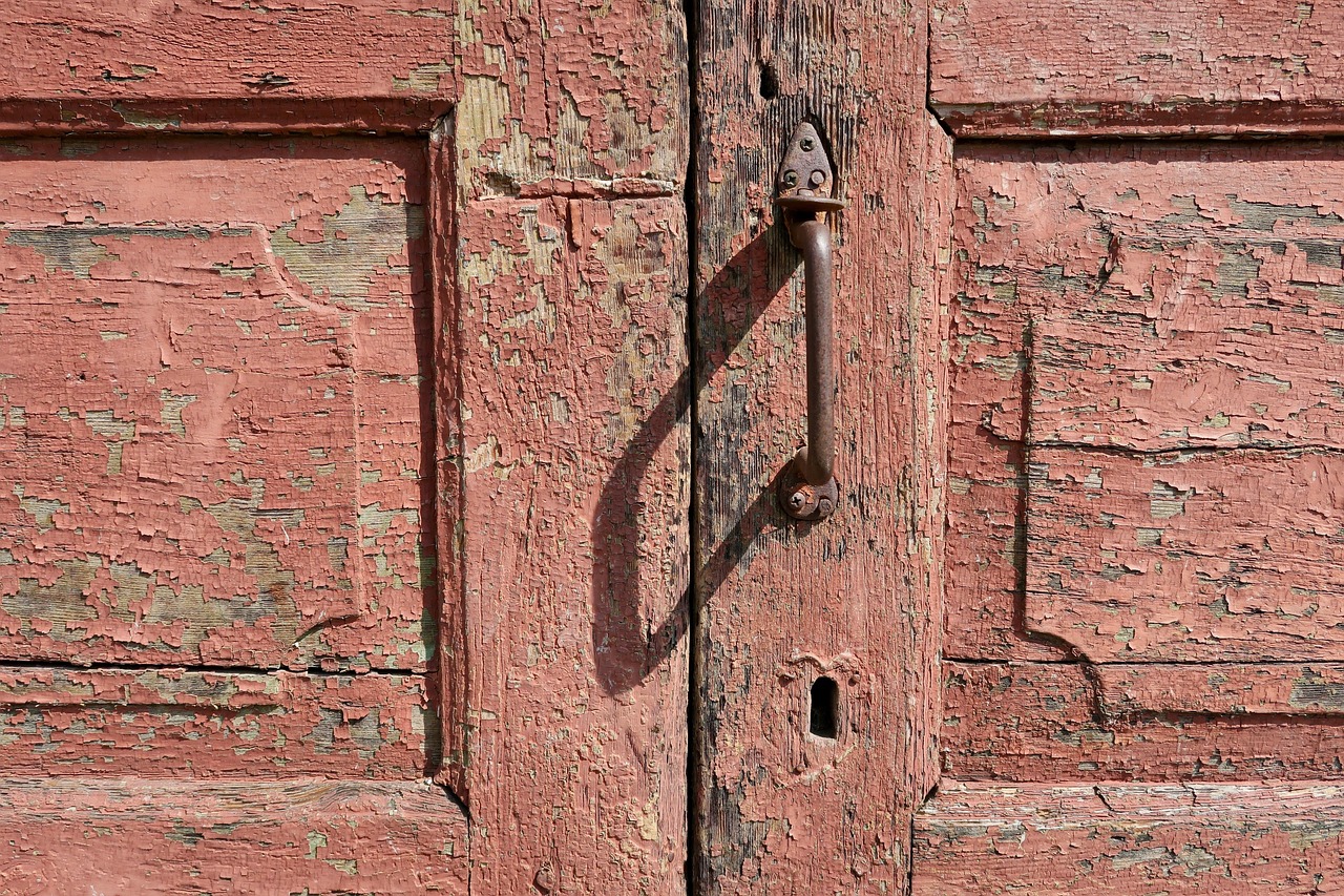 A traditional wooden front door and latch.